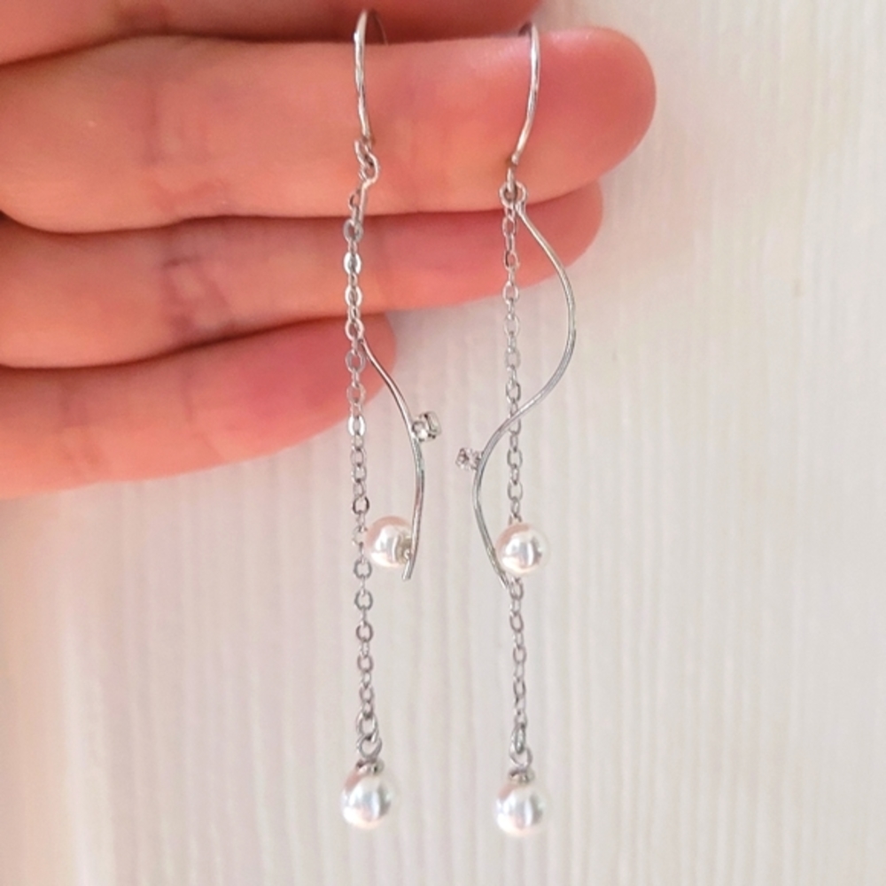 Pretty, elegant faux pearl dangle wavy silver hook earrings. Hypoallergenic